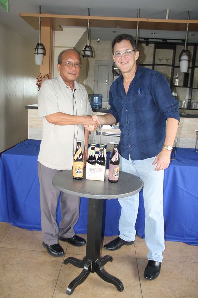 Department of Tourism Region 3 head Ronnie Tiotuico, seen here with TLC Promotions Ted Lerner, endorses the Angeles City Craft Beer Festival